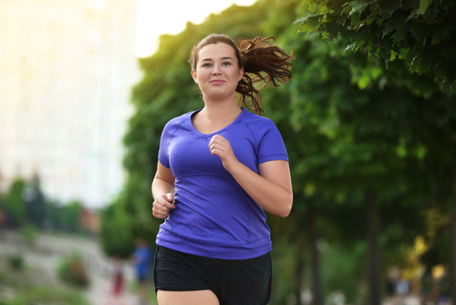 Overweight,Young,Woman,Jogging,In,The,Street.,Weight,Loss,Concept